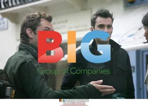 Jude Law Chats with Friends in London