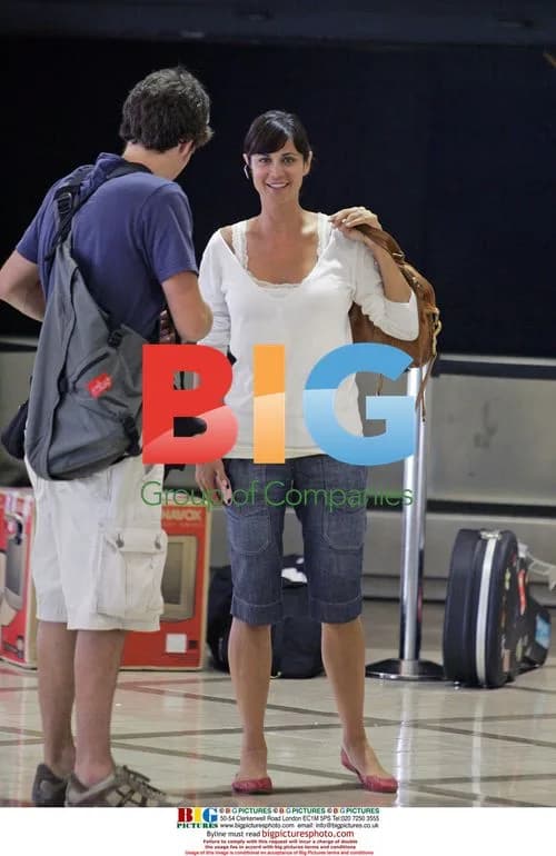 Catherine Bell Arrives at LAX with Luggage