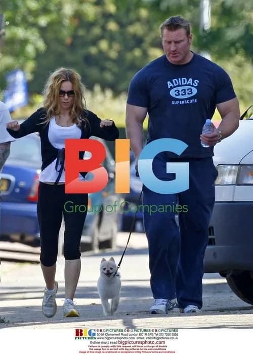 Geri Halliwell exercises with trainer and dog