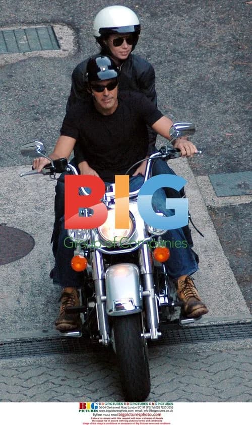 George Clooney on Harley Davidson with mystery woman