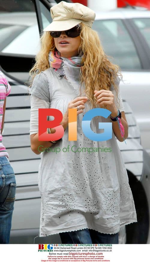 Paulina Rubio and Husband Take Stroll in Spain