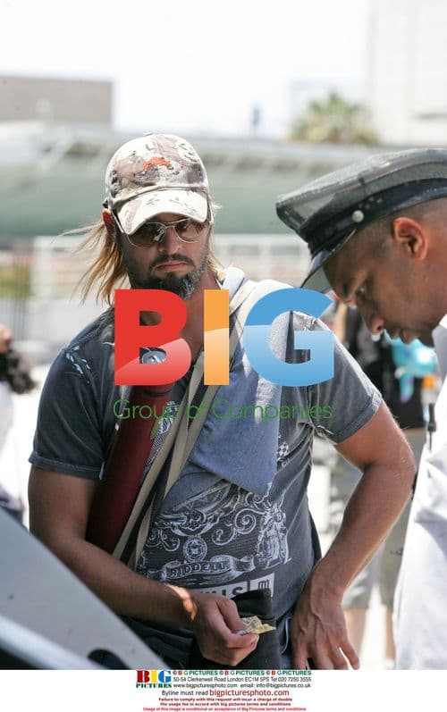 Josh Holloway and wife depart LAX