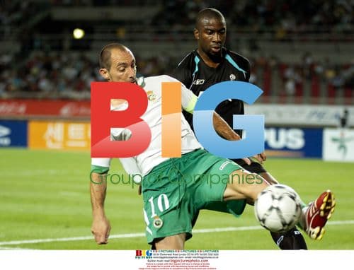 Soccer Players Battle for Ball in Peace Cup