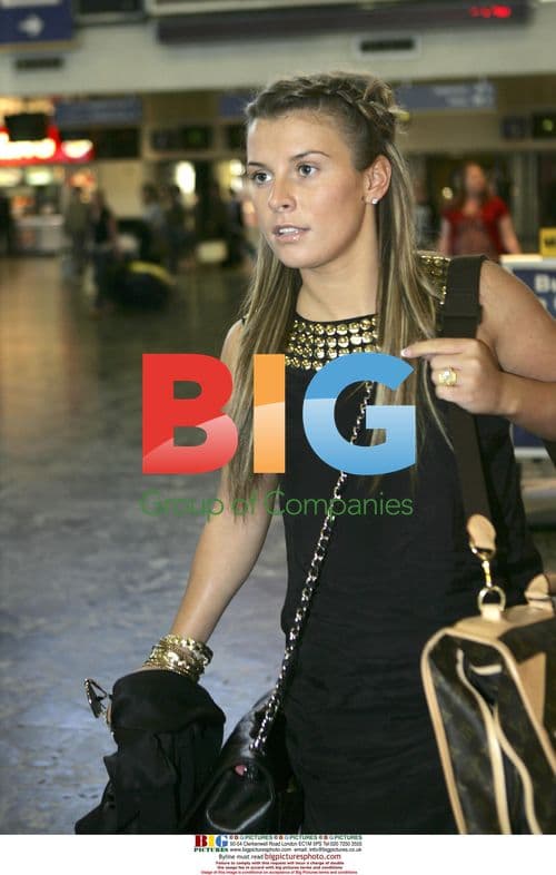 Coleen Mcloughlin with bags at Euston Station