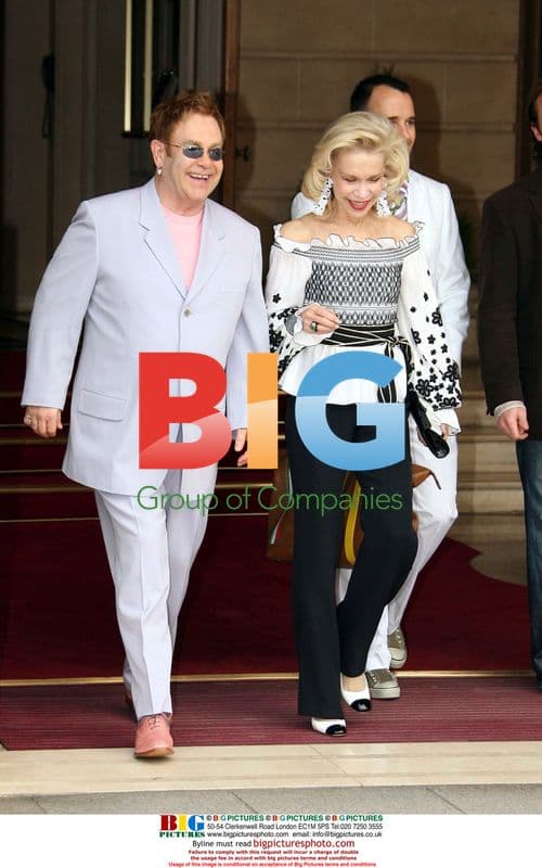 Elton John and David Furnish leave hotel in Paris