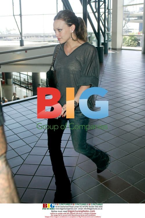 Hilary Duff shows off hoop earrings at LAX