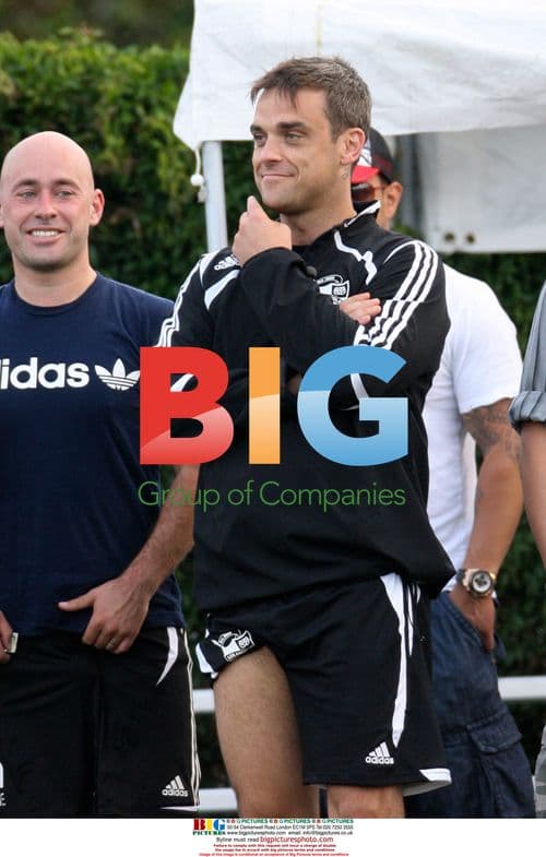 Robbie Williams Cheers Team from Sidelines