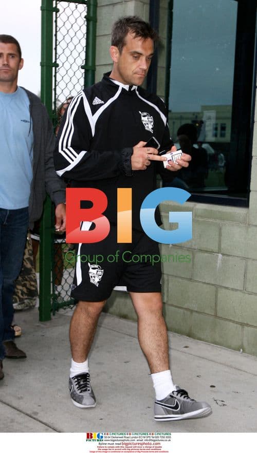 Robbie Williams Attends Soccer Match