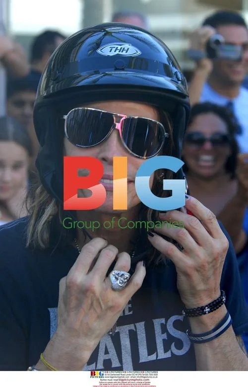 Steven Tyler Snaps Fans in Beverly Hills