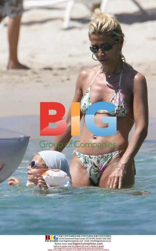 Jean Paul Belmondo with wife and daughter on beach