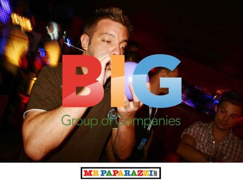 Joel blowing up balloon at Tramps Nightclub