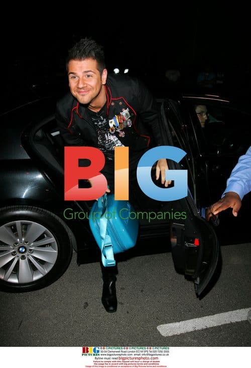 Two male Big Brother housemates enter house