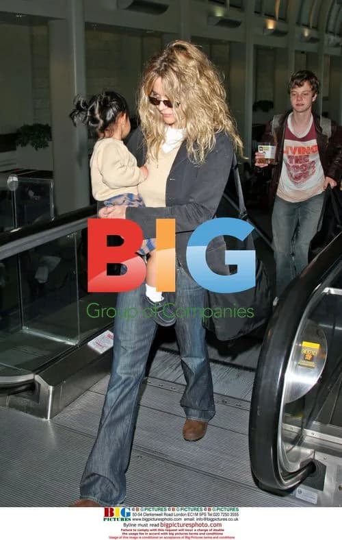 Meg Ryan departs LA with kids
