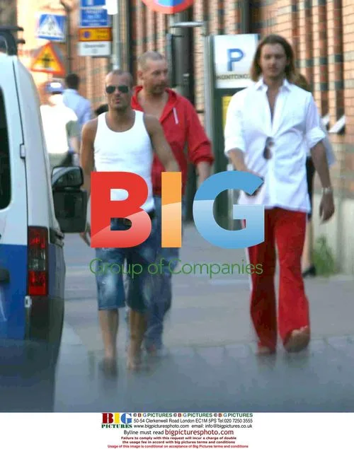 Footballer Fredrik Ljungberg Walking with Friends