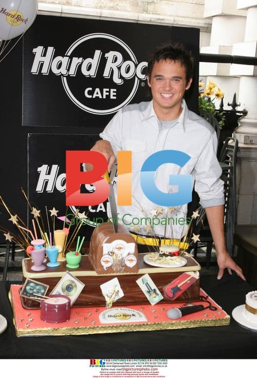Singer Gareth Gates Cuts Cake at Hard Rock Cafe