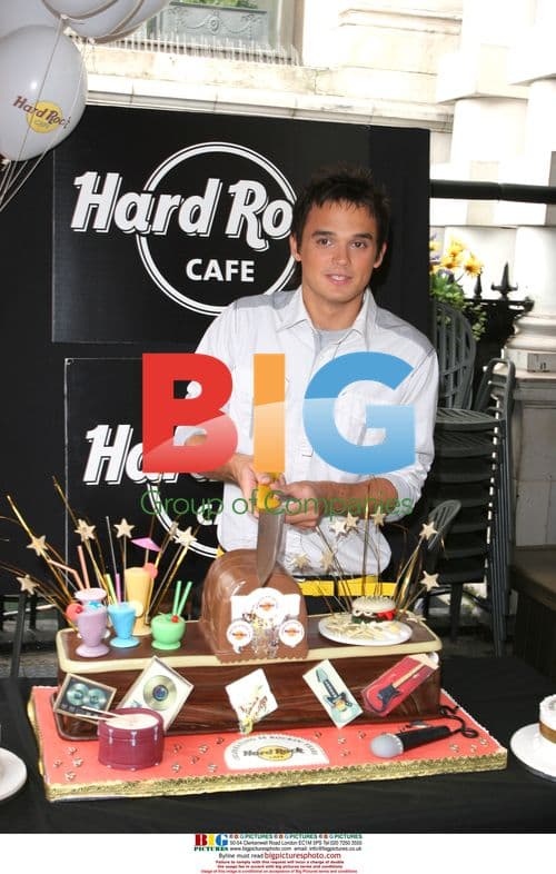 Singer Gareth Gates Cuts Cake at Hard Rock Cafe