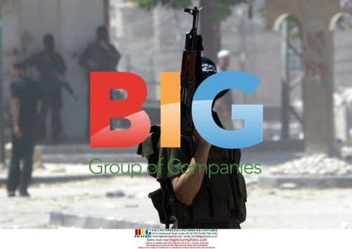 Hamas militants walk through Gaza City