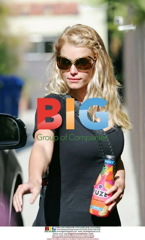 Jessica Simpson Leaves Gym with Trainer