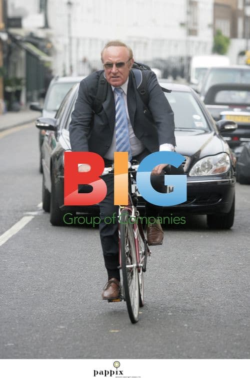 Andrew Neil rides bike without helmet in London