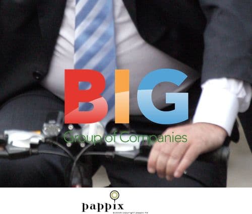 Andrew Neil riding bike in London