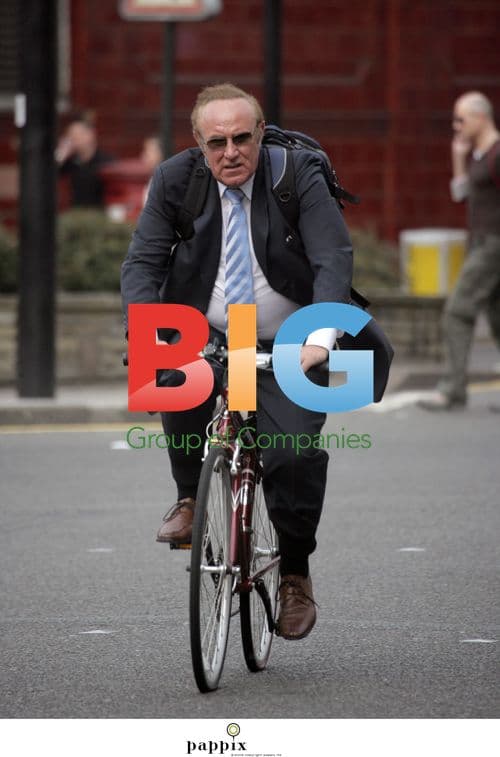 Andrew Neil riding his bike in London