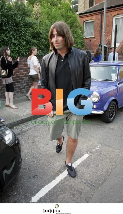 Liam Gallagher poses with teens in London