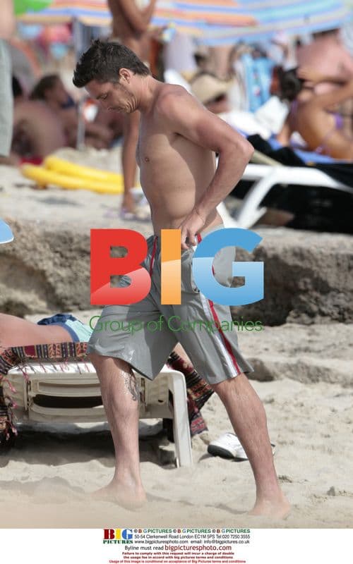 Massimo Oddo with wife and son on beach