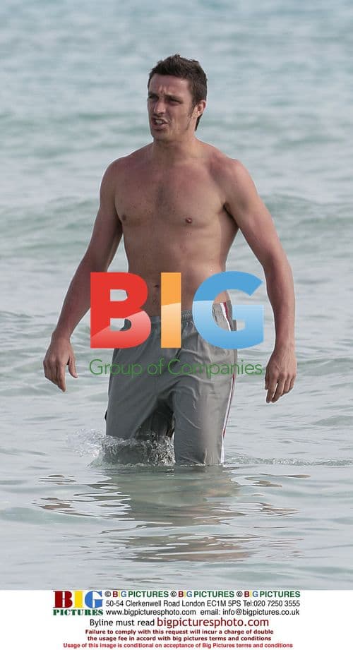 Massimo Oddo with wife and son on beach