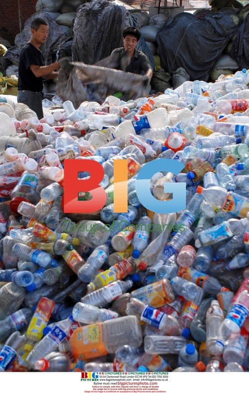 Workers sort used plastic bottles in China