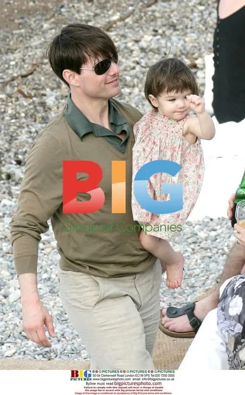 Tom Cruise, Katie Holmes, and Suri on Paloma Beach