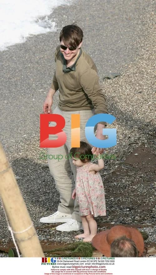 Tom Cruise and Katie Holmes with Daughter Suri on Beach