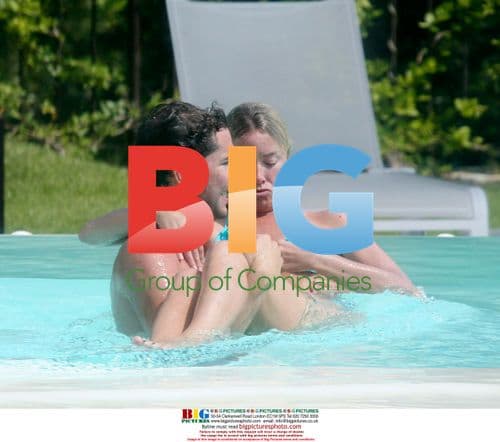 Tamzin Outhwaite and Tom Ellis pool kiss