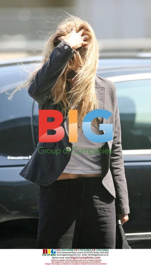 Messy Haired Meg Ryan Departs JFK Airport