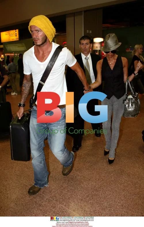 David and Victoria Beckham Arrive at Heathrow