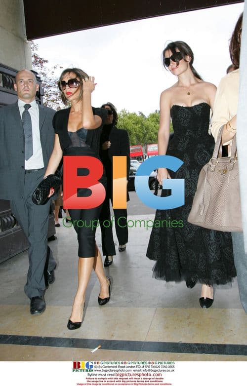 Victoria Beckham and Katie Holmes Attend Paris Fashion Show