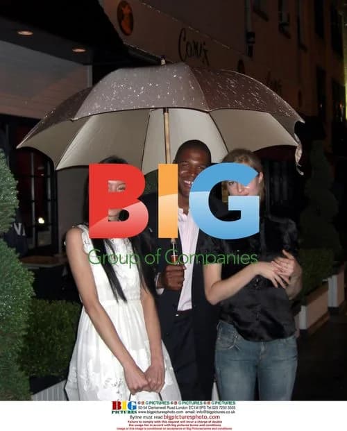Michael Strahan with Ling and Suzy at Unik's Birthday Party