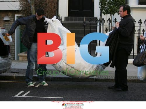 Versace stylists arrive at Liz Hurley's home