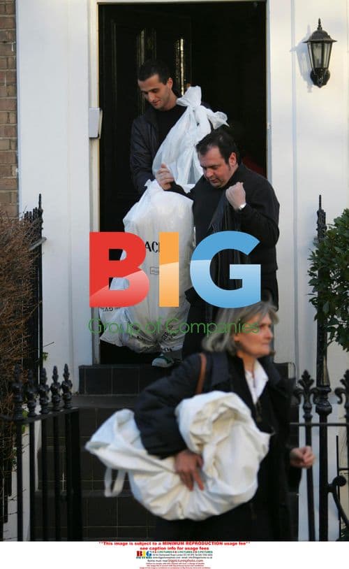 Versace team arrives at Liz Hurley's with wedding dress