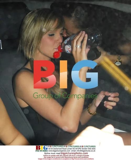 Danielle Lloyd poses in a car park lift