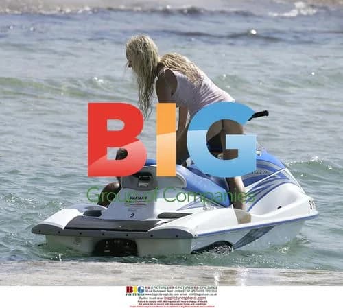 Aisleyne Horgan-Wallace rides jetski in Spain
