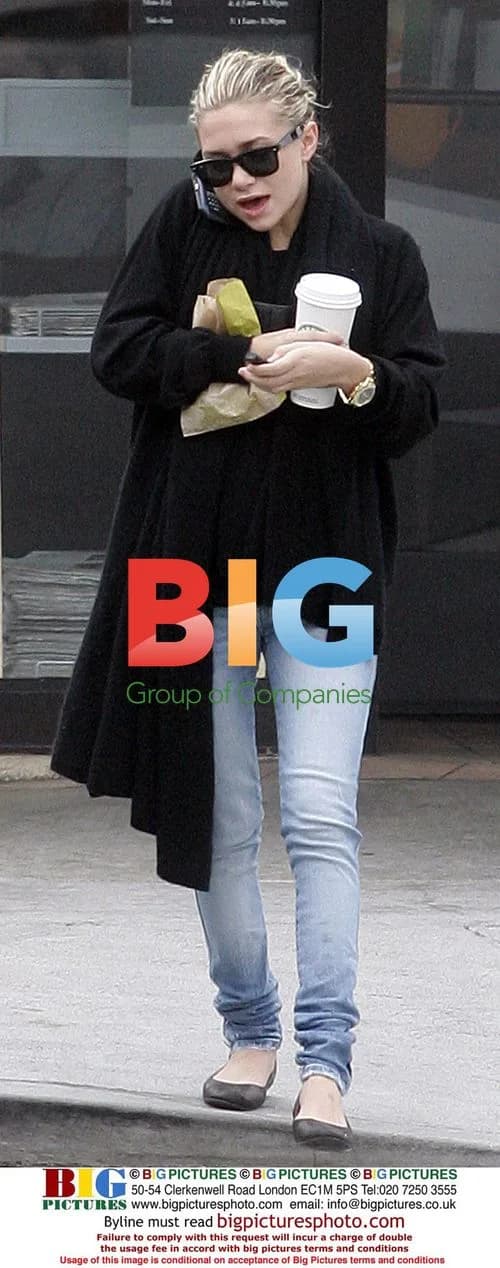 Ashley Olsen multitasks with coffee and phone