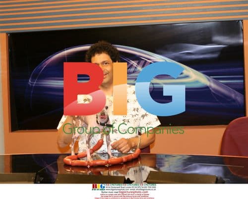 Owner DANE ANDREW holds RASCAL The World's Ugliest Dog