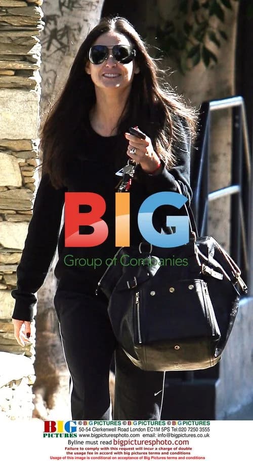Demi Moore in Workout Gear with YSL Bag