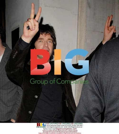 Noel Gallagher with friends at bar in Soho