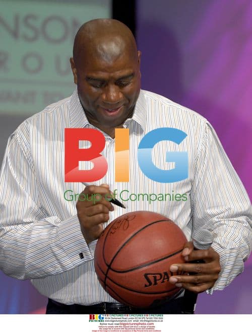 Magic Johnson Addresses Crowd, Signs Basketballs