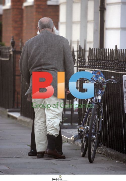 Alexei Sayle out on bike in London