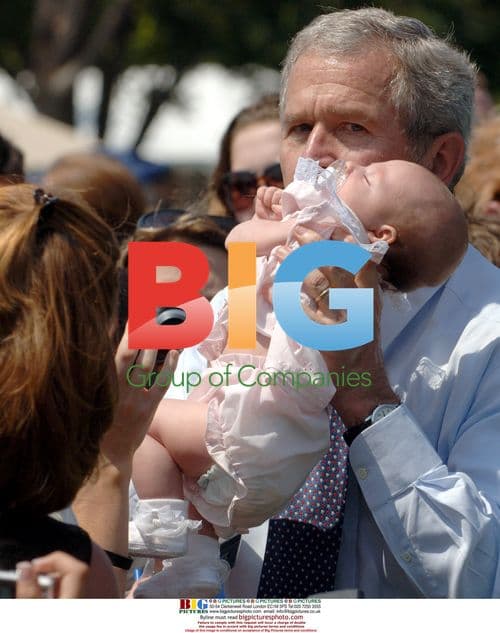 George W. Bush Holds Baby at Peace Officers' Memorial