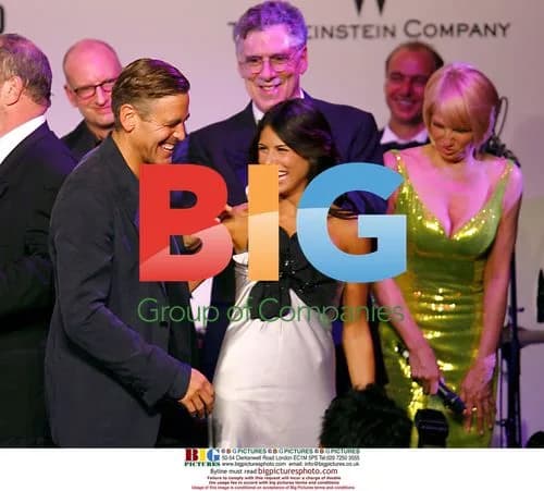 George Clooney Kisses Auction Winner at amfAR Gala