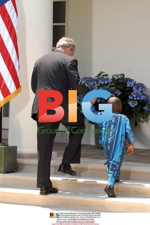 George W. Bush Holds Boy with AIDS-Affected Mother