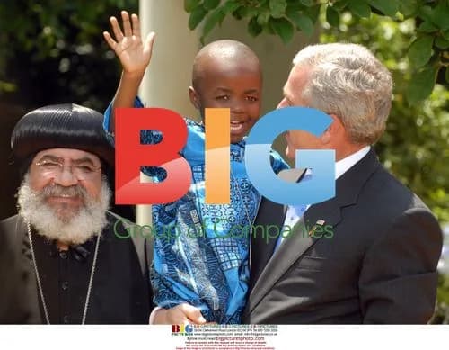 Bush Holds Boy Living with AIDS